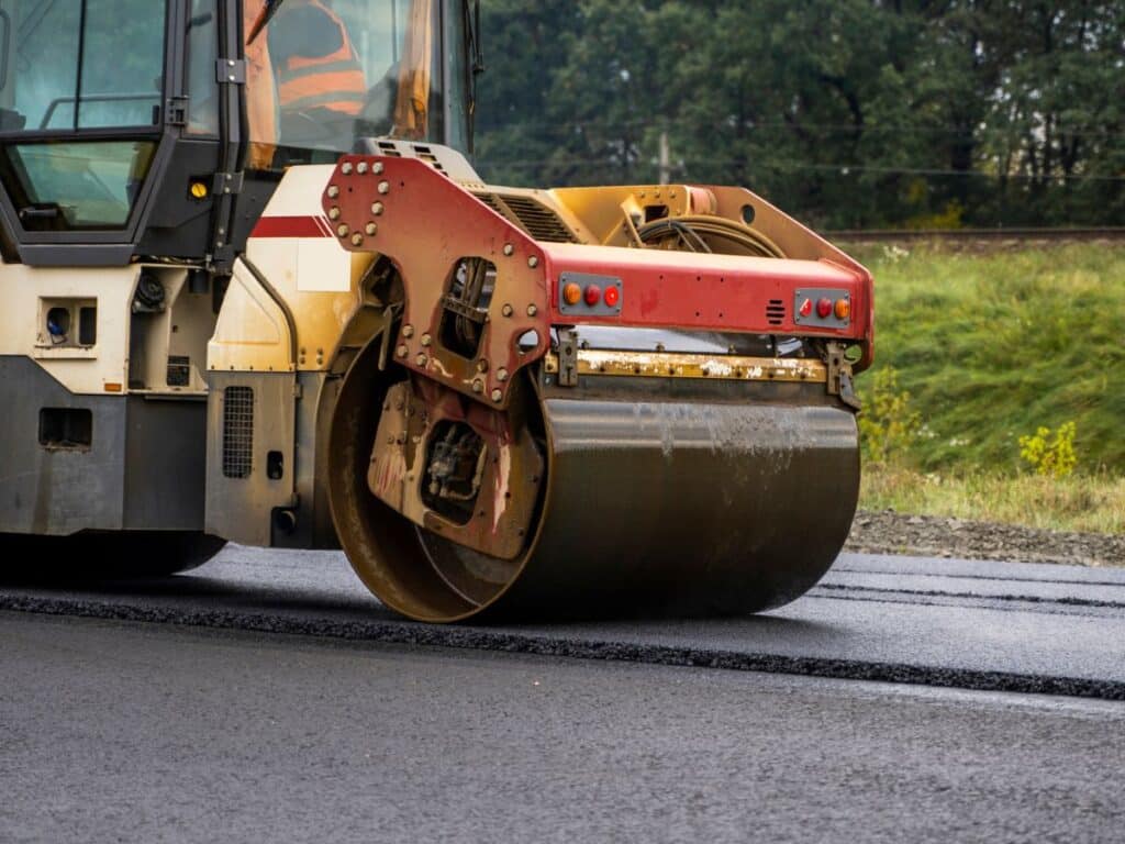 a road paver finisher doing asphalt repair in the road